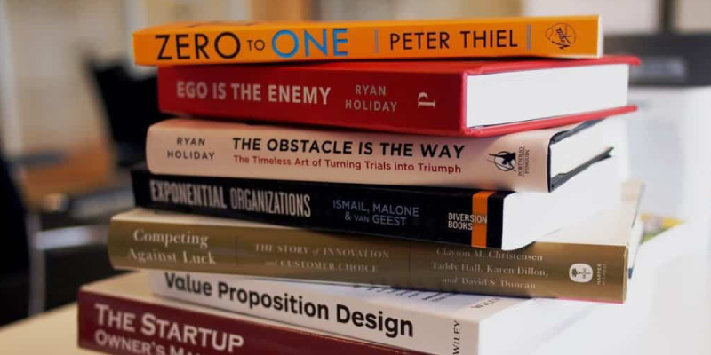 A Stack of Books Placed On The Table About Marketing Books For Startup Owners, Value preposition Design.