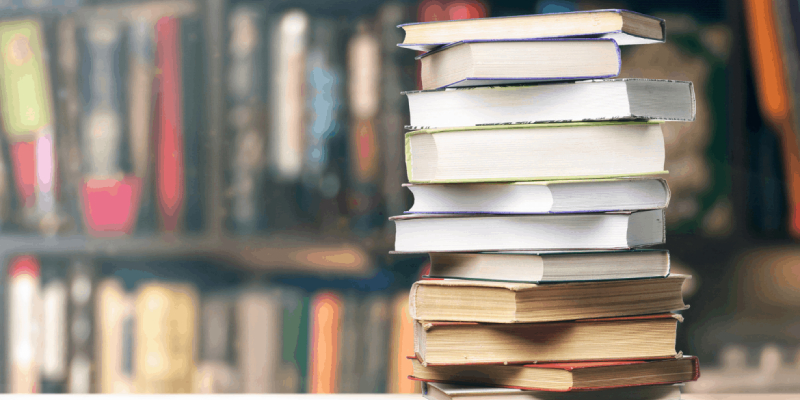 A Pile Of Marketing Books Placed On The Library Table.