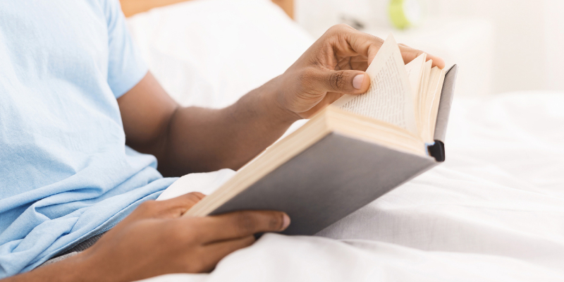 A Person Reading A Book About Social Media Marketing