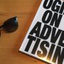 A Book Called Ogilvy On Advertising - Placed On The Table.