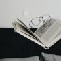 A Pile Of Books About Seo - Placed On The Table With Glasses.