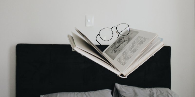 A Pile Of Books About Seo - Placed On The Table With Glasses.